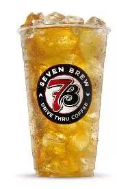 Fresh cup of green tea with a light golden hue and soothing aroma