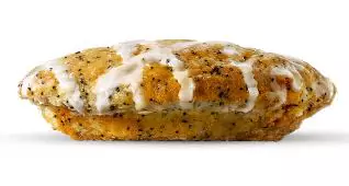 Soft lemon poppy seed muffin top with a golden crust and zesty citrus aroma